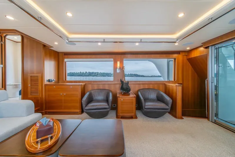 Smile Smile Smile Yacht Photos Pics Luxurious interior of 2022 Outer Reef 720 Motor Yacht with elegant wood paneling.