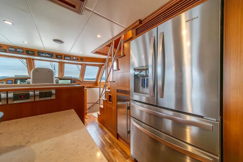 Smile Smile Smile Yacht Photos Pics Luxurious interior of 2022 Outer Reef 720 Motor Yacht with modern kitchen appliances.