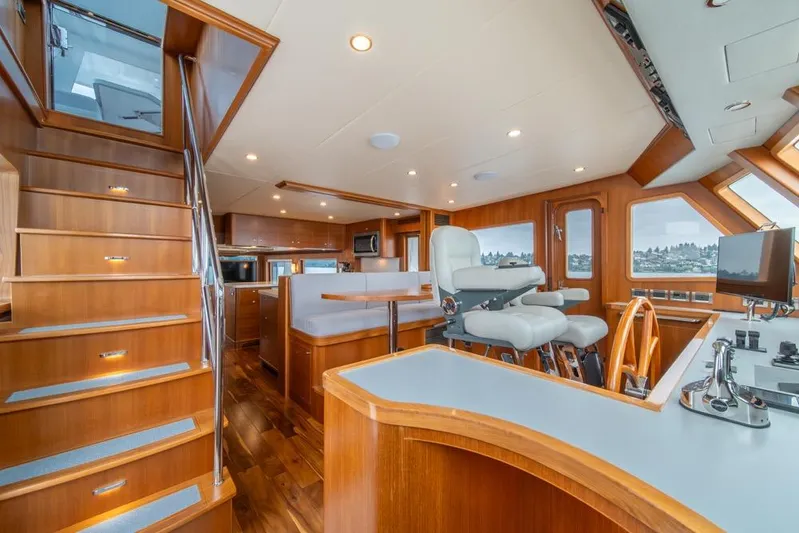 Smile Smile Smile Yacht Photos Pics Luxurious interior of 2022 Outer Reef 720 Motor Yacht with wooden finishes and modern amenities.