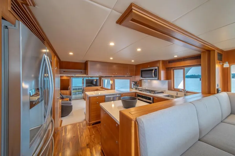 Smile Smile Smile Yacht Photos Pics Luxurious kitchen interior of 2022 Outer Reef 720 Motor Yacht with modern appliances.