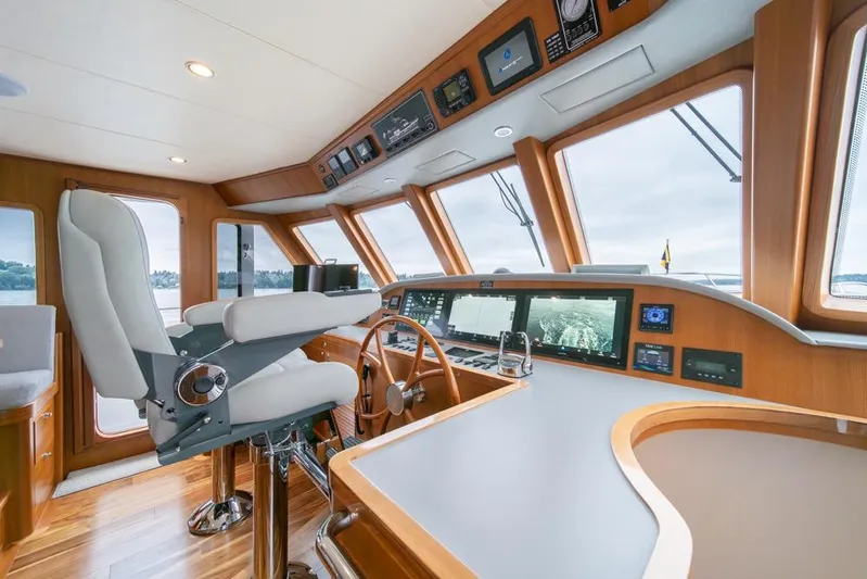 Smile Smile Smile Yacht Photos Pics Luxurious helm of 2022 Outer Reef 720 Motor Yacht with advanced navigation systems.