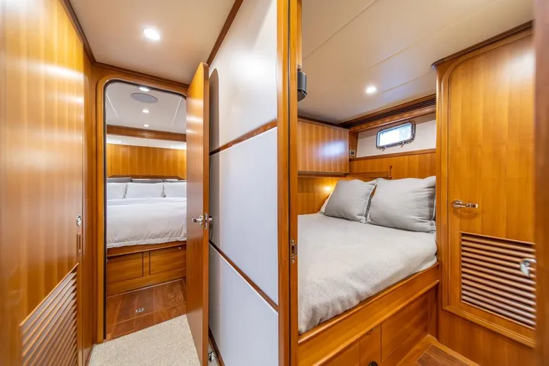 Smile Smile Smile Yacht Photos Pics Luxurious interior of 2022 Outer Reef 720 Motor Yacht with cozy wooden cabin.