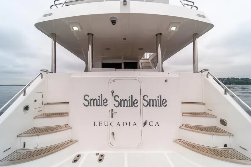 Smile Smile Smile Yacht Photos Pics 2022 Outer Reef 720 Motor Yacht stern with "Smile Smile Smile" text, Leucadia, CA.