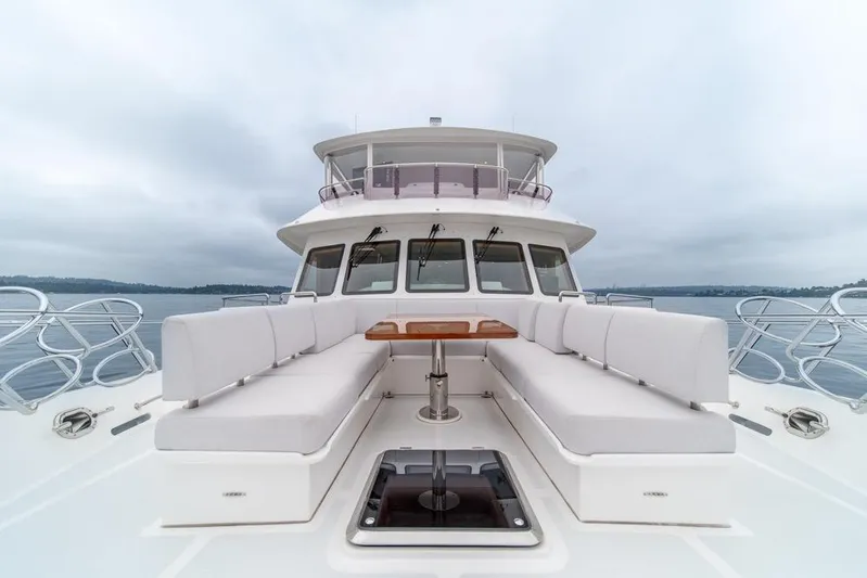 Smile Smile Smile Yacht Photos Pics 2022 Outer Reef 720 Motor Yacht with spacious deck seating and ocean view.