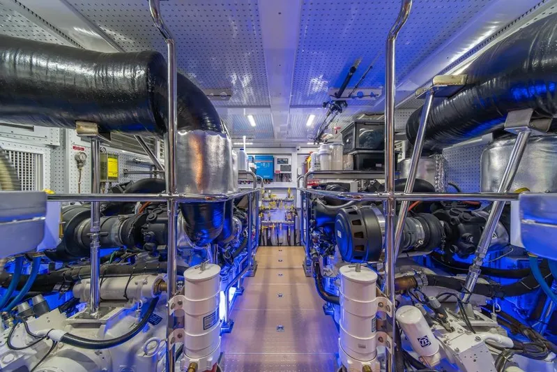 Smile Smile Smile Yacht Photos Pics Engine room of 2022 Outer Reef 720 Motor Yacht, showcasing advanced machinery and equipment.