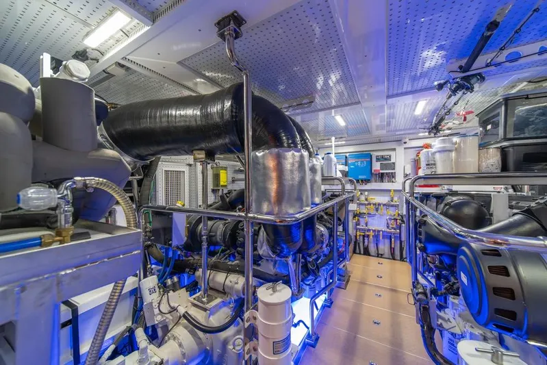 Smile Smile Smile Yacht Photos Pics Engine room of 2022 Outer Reef 720 Motor Yacht, showcasing advanced machinery and equipment.