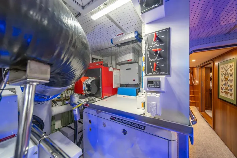 Smile Smile Smile Yacht Photos Pics Engine room of 2022 Outer Reef 720 Motor Yacht with control panels and equipment.