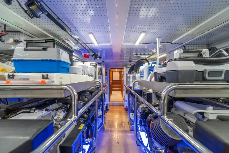 Smile Smile Smile Yacht Photos Pics Engine room of 2022 Outer Reef 720 Motor Yacht, featuring organized equipment and storage.