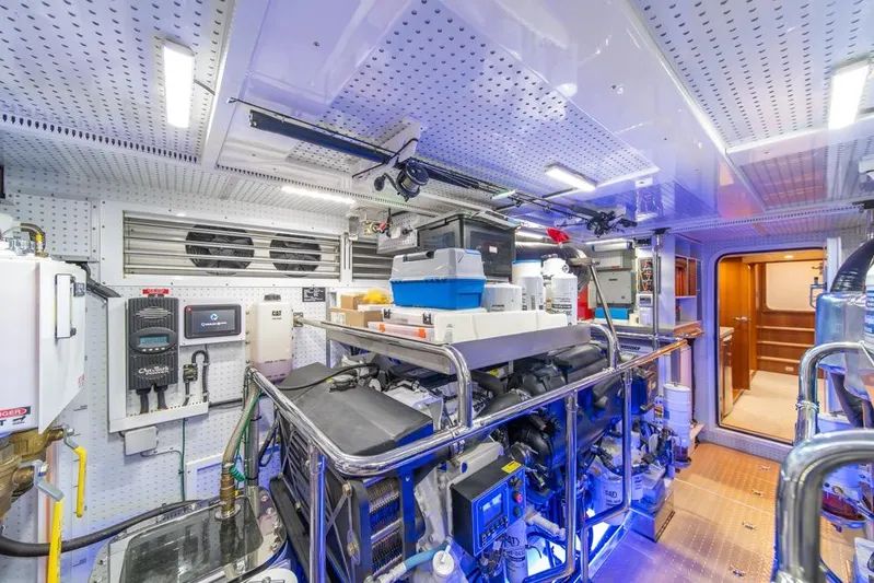 Smile Smile Smile Yacht Photos Pics Engine room of 2022 Outer Reef 720 Motor Yacht, featuring advanced equipment and organized layout.