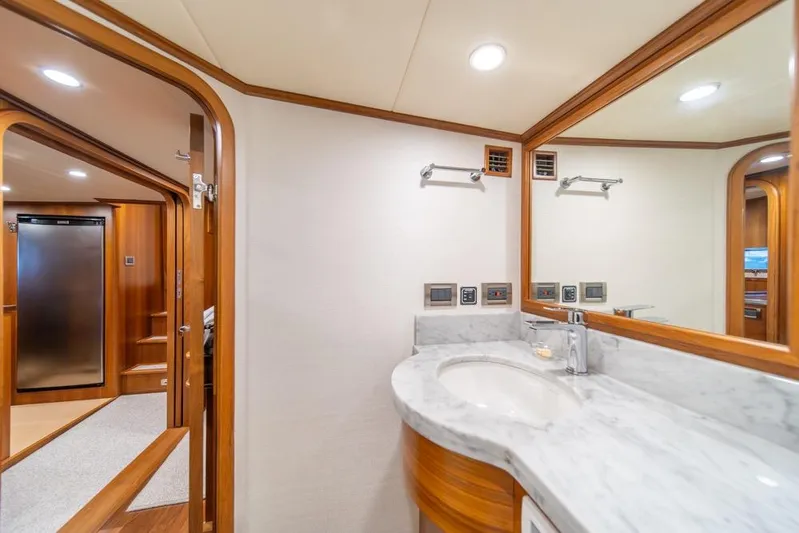 Smile Smile Smile Yacht Photos Pics Luxurious bathroom interior of 2022 Outer Reef 720 Motor Yacht with marble countertop.