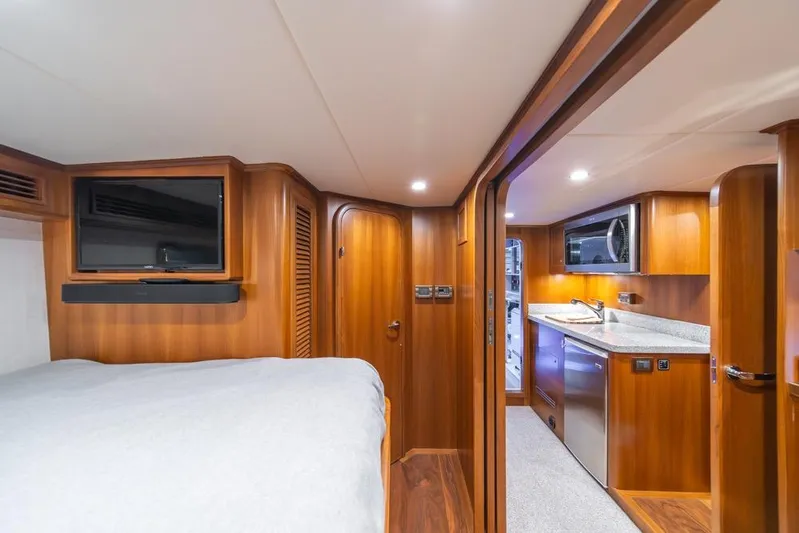Smile Smile Smile Yacht Photos Pics Luxurious interior of 2022 Outer Reef 720 Motor Yacht with wood finishes and modern amenities.