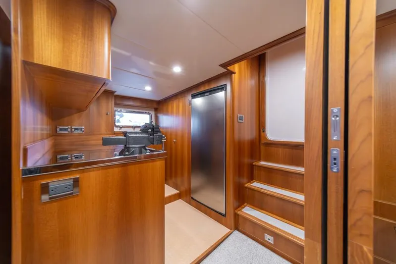 Smile Smile Smile Yacht Photos Pics Interior of 2022 Outer Reef 720 Motor Yacht with wood finish and modern amenities.