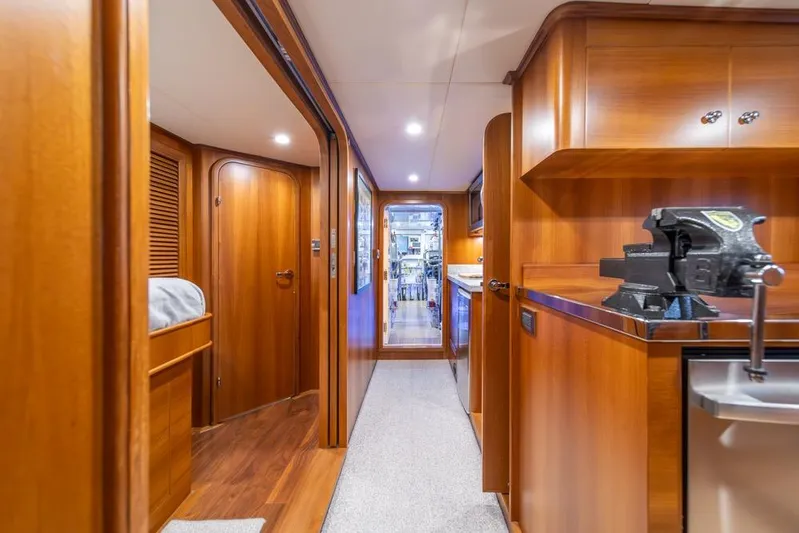 Smile Smile Smile Yacht Photos Pics Luxurious interior of 2022 Outer Reef 720 Motor Yacht with wood finishes and modern amenities.