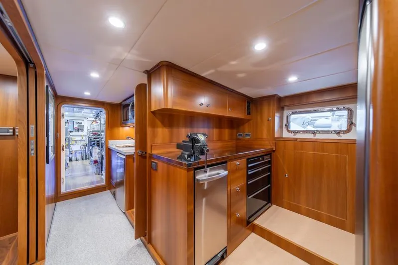 Smile Smile Smile Yacht Photos Pics Luxurious interior of 2022 Outer Reef 720 Motor Yacht with wood finishes and modern amenities.