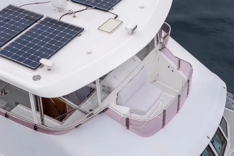 Smile Smile Smile Yacht Photos Pics 2022 Outer Reef 720 Motor Yacht with solar panels and seating area on deck.