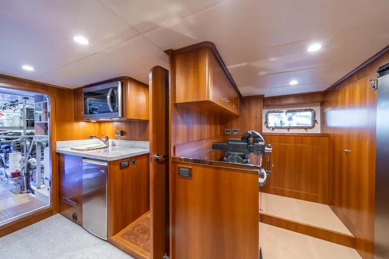 Smile Smile Smile Yacht Photos Pics Luxurious interior of 2022 Outer Reef 720 Motor Yacht with modern kitchen amenities.