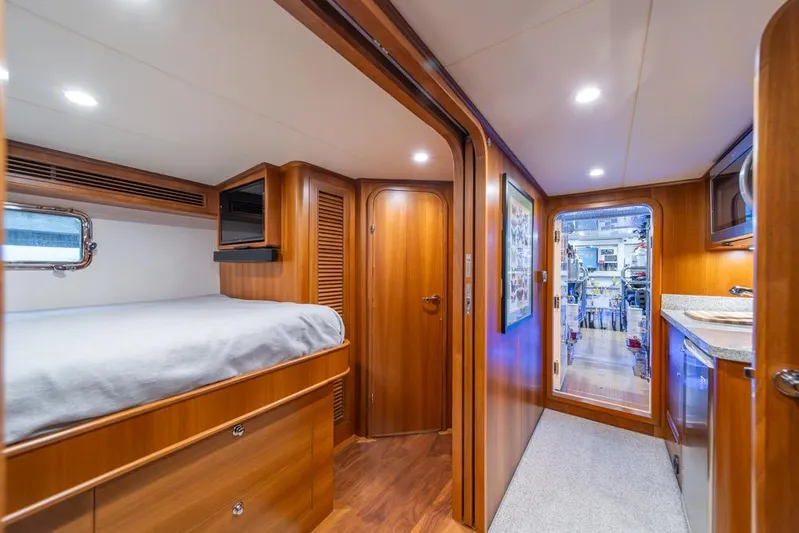 Smile Smile Smile Yacht Photos Pics Luxurious interior of 2022 Outer Reef 720 Motor Yacht with wood finishes and modern amenities.