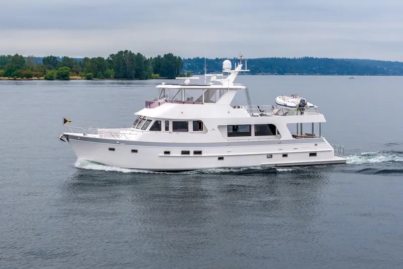 Smile Smile Smile Yacht Photos Pics 2022 Outer Reef 720 Motor Yacht cruising on calm waters.