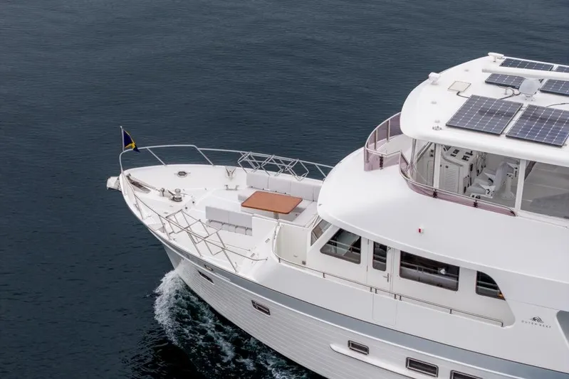 Smile Smile Smile Yacht Photos Pics 2022 Outer Reef 720 Motor Yacht cruising with solar panels on deck.