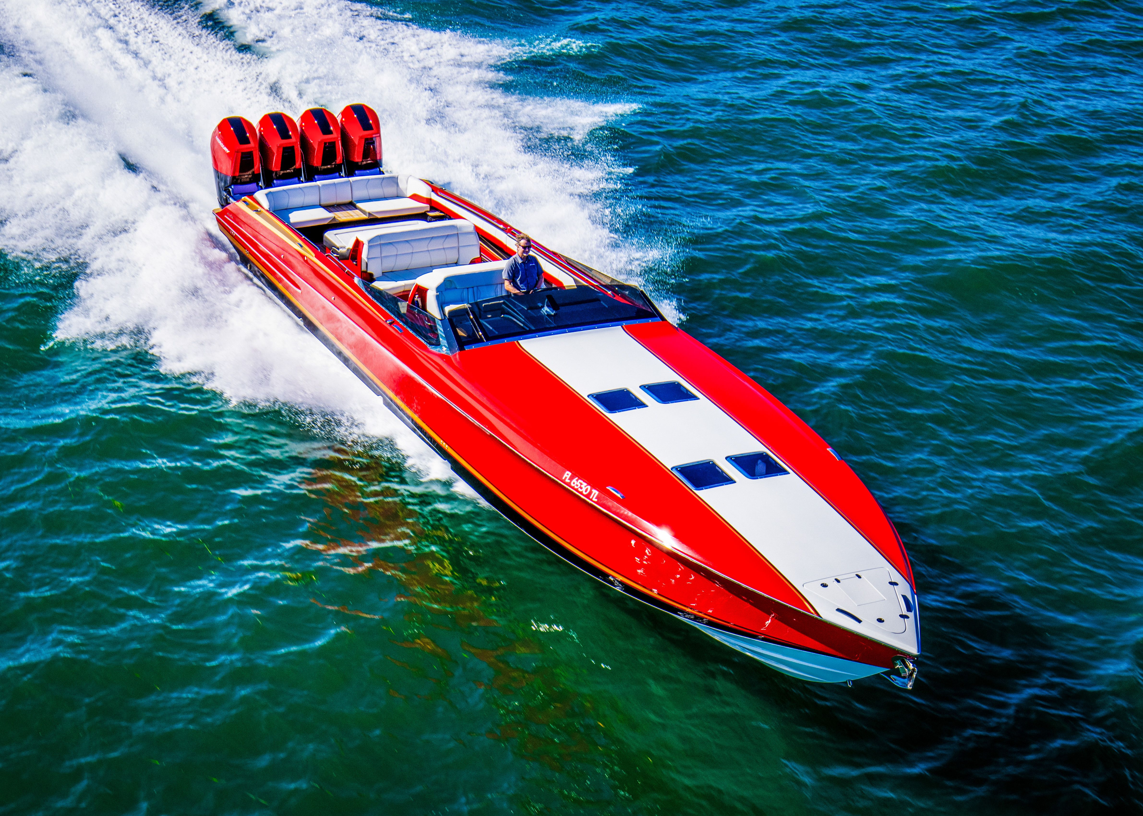 2026 Nor-Tech 550 & 560 Sport Center Console speeding on water, vibrant red and white design.