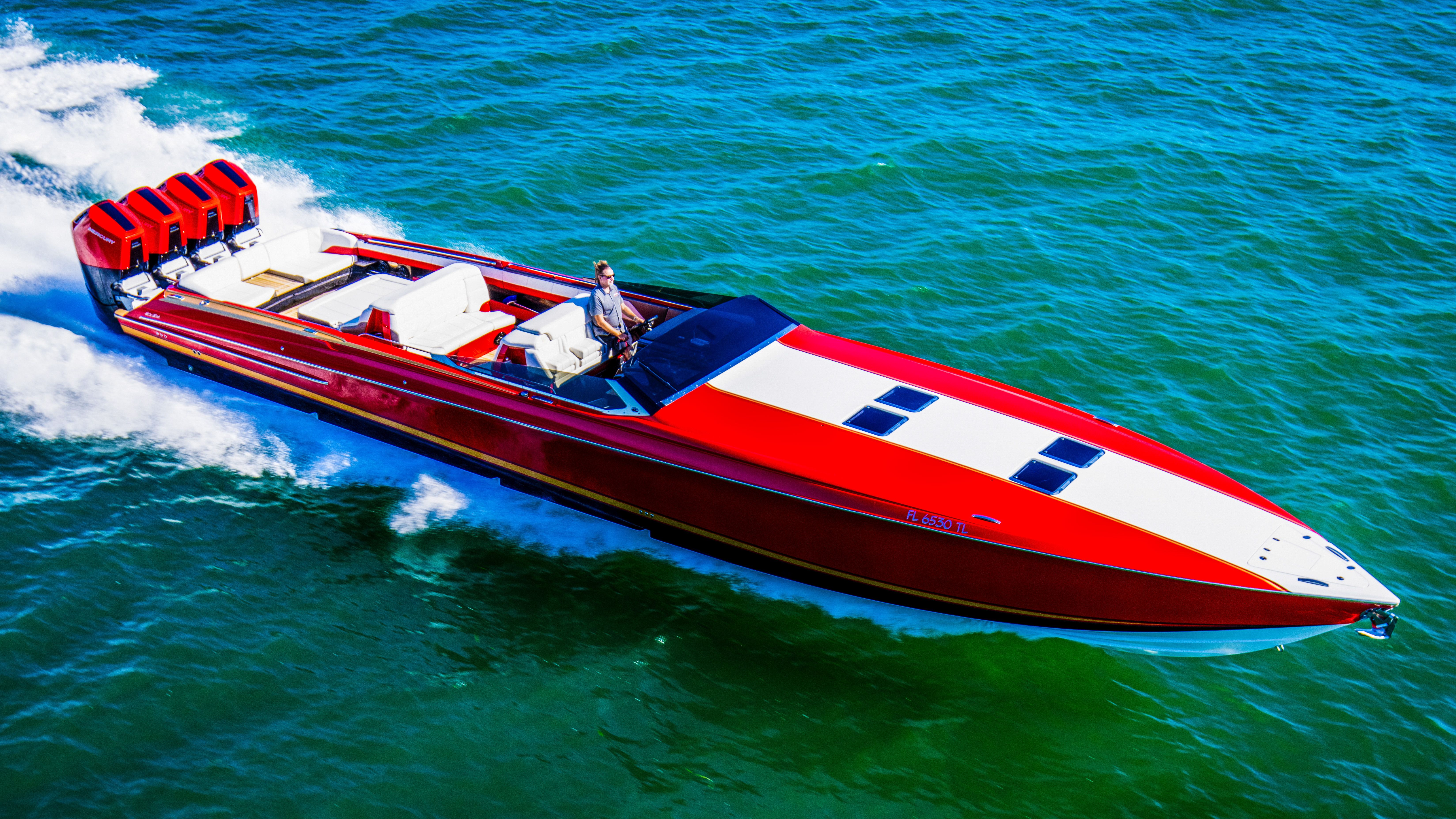 Red 2026 Nor-Tech 550 & 560 Sport Center Console boat cruising on open water.
