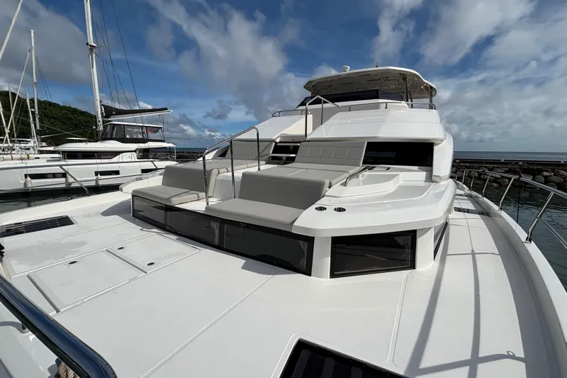  Yacht Photos Pics Aquila 54 Yacht 2025 with spacious deck and modern design, docked at marina.