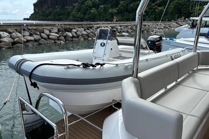  Yacht Photos Pics Aquila 54 Yacht 2025 docked, featuring sleek design and modern seating.