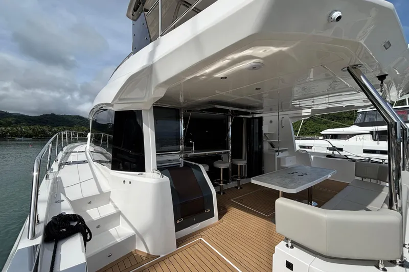  Yacht Photos Pics Aquila 54 Yacht 2025, featuring a sleek deck and luxurious seating area.