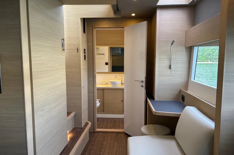  Yacht Photos Pics Luxurious interior of 2025 Aquila 54 Yacht with modern design and scenic window view.