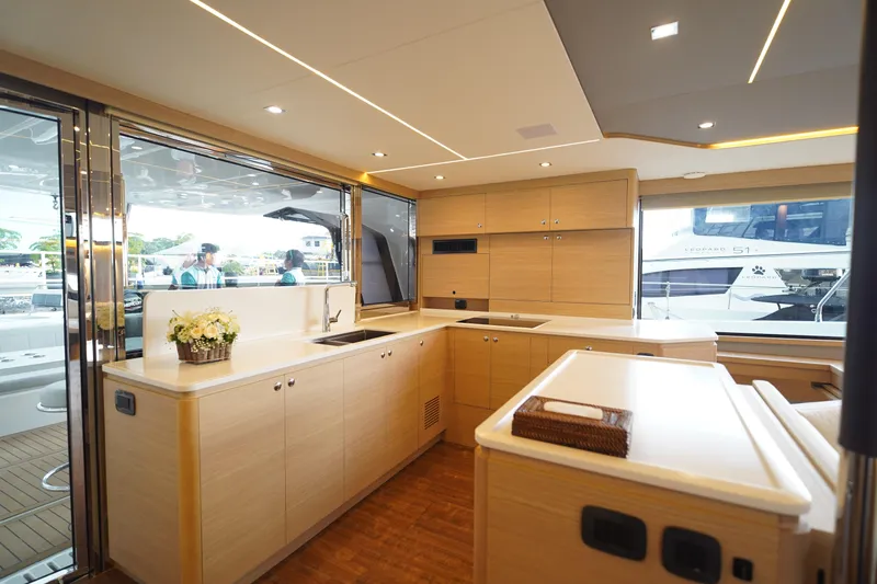  Yacht Photos Pics Luxurious interior of 2025 Aquila 54 Yacht with modern kitchen design.