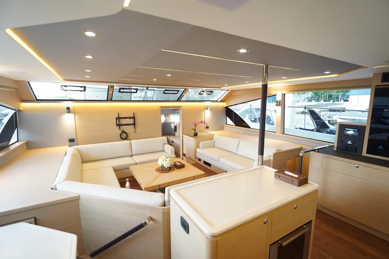  Yacht Photos Pics Luxurious interior of 2025 Aquila 54 Yacht with modern furnishings and ample natural light.