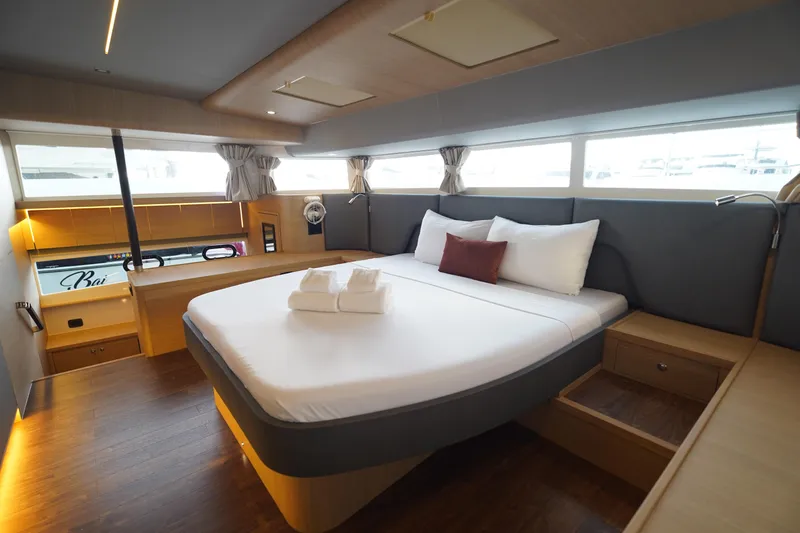  Yacht Photos Pics Luxurious bedroom interior of 2025 Aquila 54 Yacht with modern design and elegant furnishings.