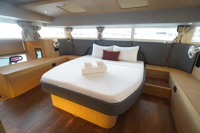  Yacht Photos Pics Luxurious bedroom interior of 2025 Aquila 54 Yacht with modern design and cozy ambiance.
