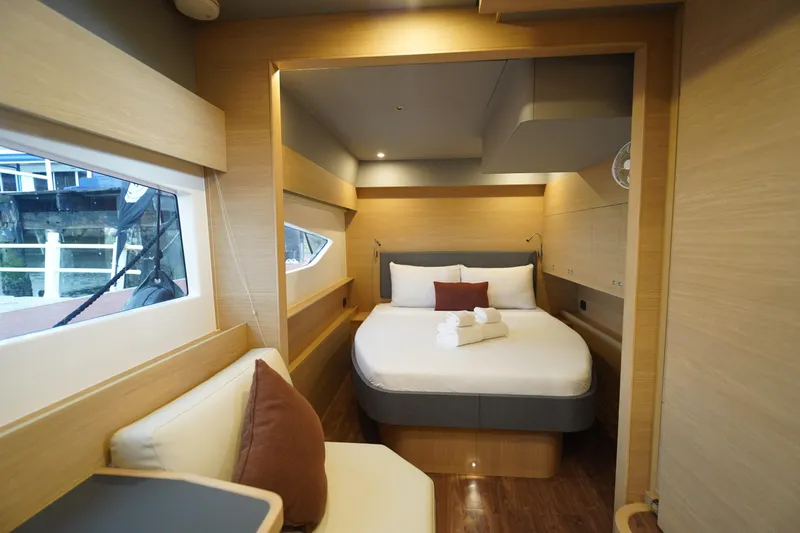  Yacht Photos Pics Luxurious bedroom interior of 2025 Aquila 54 Yacht with modern design and cozy ambiance.