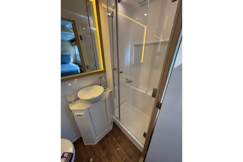  Yacht Photos Pics Luxurious bathroom in 2025 Aquila 54 Yacht with modern fixtures and elegant design.