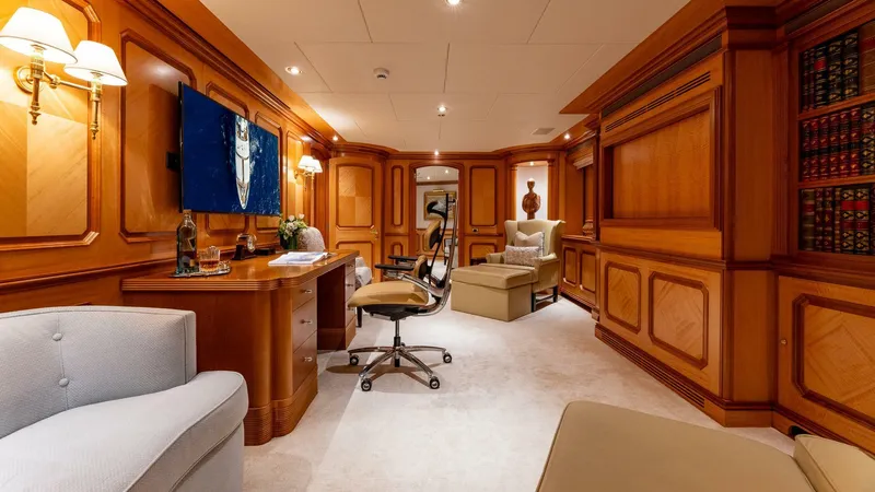 Amanti Yacht Photos Pics Luxurious interior of 2003 Feadship 51.8M yacht with elegant wood paneling and modern furnishings.