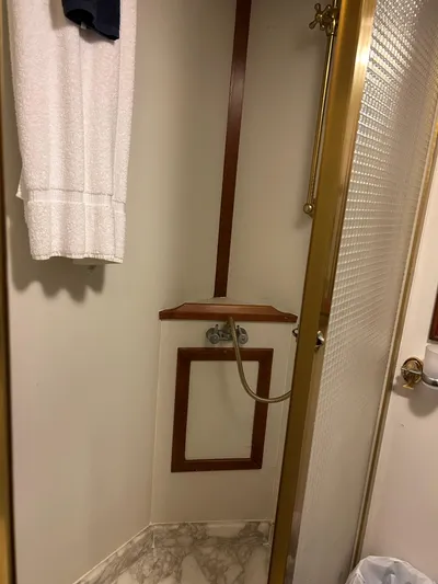 Broker Of Venice Yacht Photos Pics 1988 Sea Ranger aft cabin shower with gold trim and marble floor.