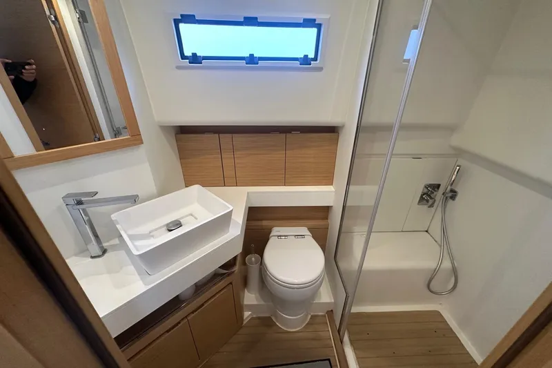  Yacht Photos Pics Modern bathroom in 2021 Pardo Yachts 43, featuring sleek fixtures and wooden accents.