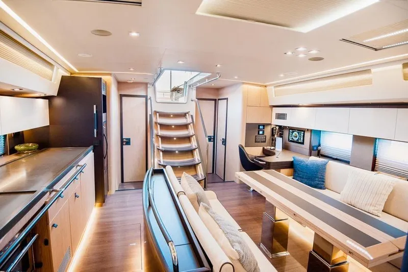 Dictador Yacht Photos Pics Luxurious interior of 2022 Beneteau Oceanis Yacht 62 with modern design and elegant furnishings.