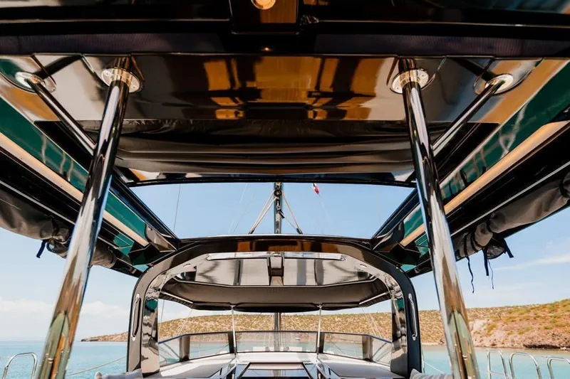 Dictador Yacht Photos Pics 2022 Beneteau Oceanis Yacht 62 deck view with sleek design and ocean backdrop.