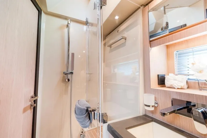 Dictador Yacht Photos Pics Luxurious bathroom interior of 2022 Beneteau Oceanis Yacht 62, featuring modern fixtures and elegant design.