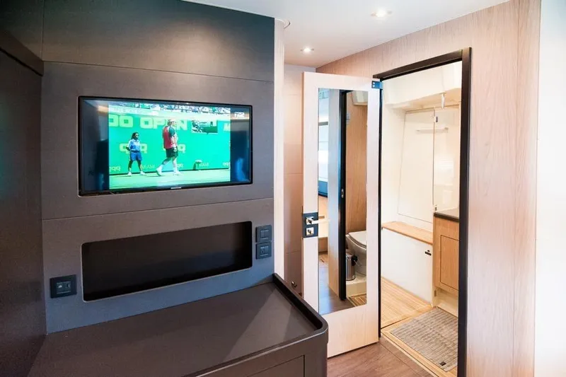 Dictador Yacht Photos Pics Interior of 2022 Beneteau Oceanis Yacht 62 with TV and bathroom view.