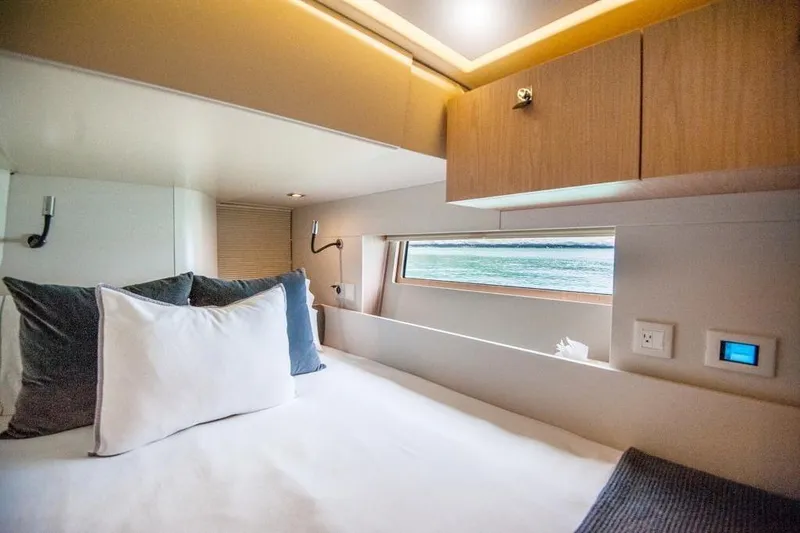 Dictador Yacht Photos Pics Luxurious cabin interior of 2022 Beneteau Oceanis Yacht 62 with ocean view.