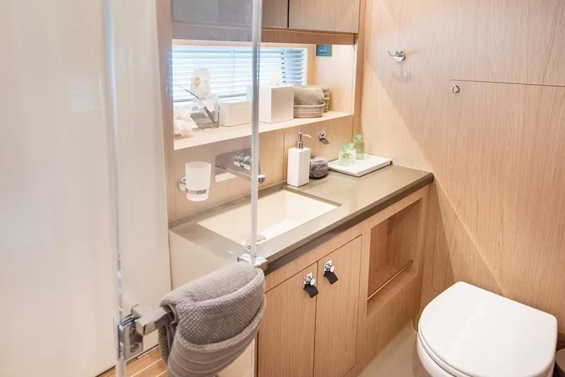 Dictador Yacht Photos Pics Luxurious bathroom in 2022 Beneteau Oceanis Yacht 62, featuring modern fixtures and elegant design.