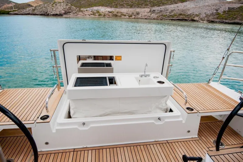 Dictador Yacht Photos Pics Beneteau Oceanis Yacht 62, 2022 model, featuring a sleek deck and outdoor sink.