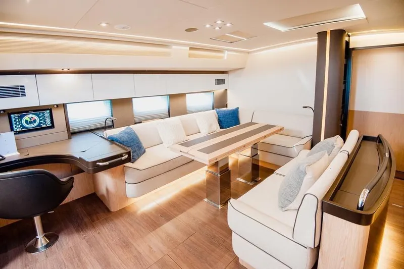 Dictador Yacht Photos Pics Luxurious interior of 2022 Beneteau Oceanis Yacht 62 with modern seating and elegant design.
