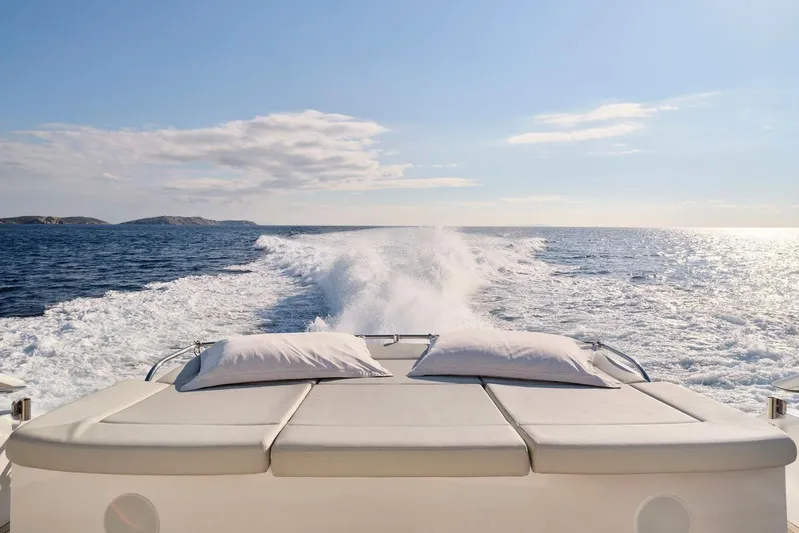 For Ever Yacht Photos Pics Luxurious 2008 Pershing 80 yacht cruising on open sea with sunbed view.