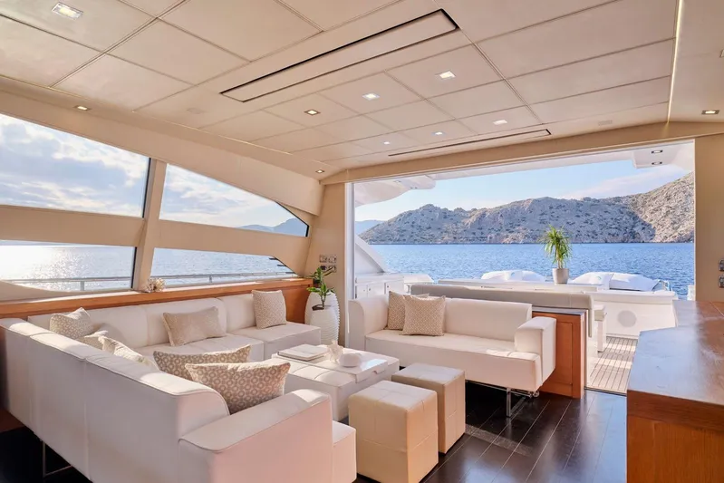For Ever Yacht Photos Pics Luxurious interior of 2008 Pershing 80 yacht with ocean view and elegant white seating.