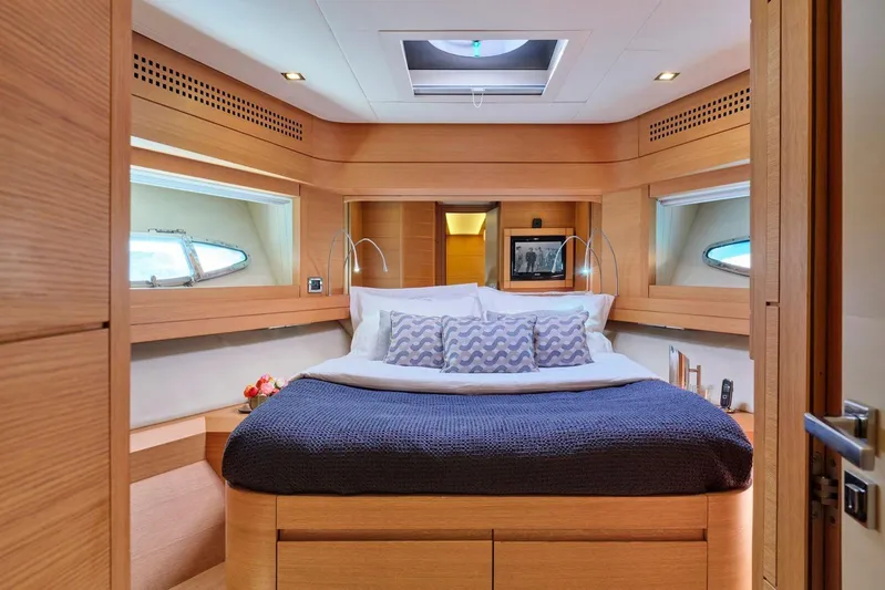 For Ever Yacht Photos Pics Luxurious bedroom interior of 2008 Pershing 80 yacht with modern design and cozy bedding.