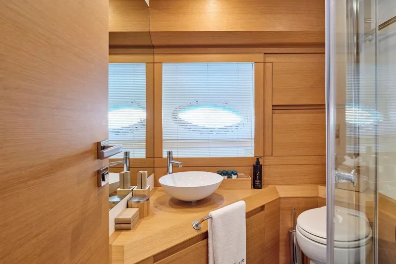 For Ever Yacht Photos Pics Luxurious wooden bathroom interior on 2008 Pershing 80 yacht, featuring modern fixtures and elegant design.